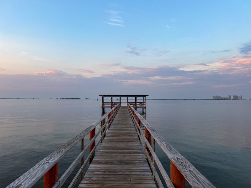 Sunrise over the pier at Emerald Beach RV Park in Navarre, Florida
