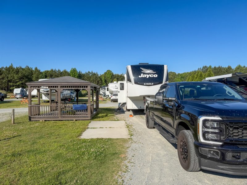 Our fifth wheel and F-350 on a pull-through site at The RV Resort at Carolina Crossroads
