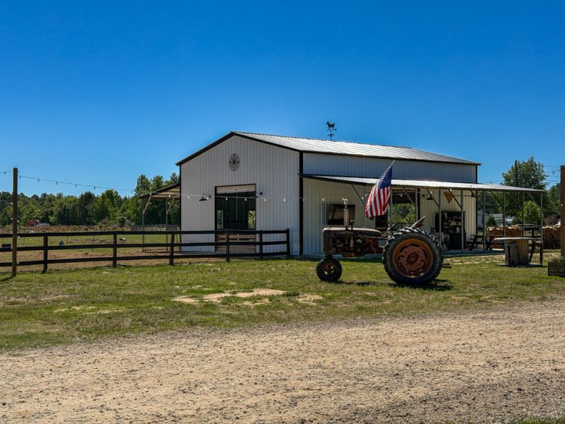 Barn and tractor at Outside Inn Campground, a working farm in Santee, South Carolina
