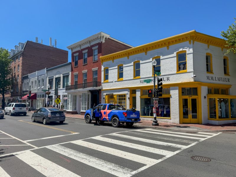 Colorful historic storefronts on a Georgetown street corner