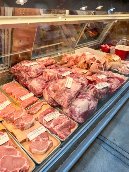 Dry-aged steaks in the butcher case at Eastern Market