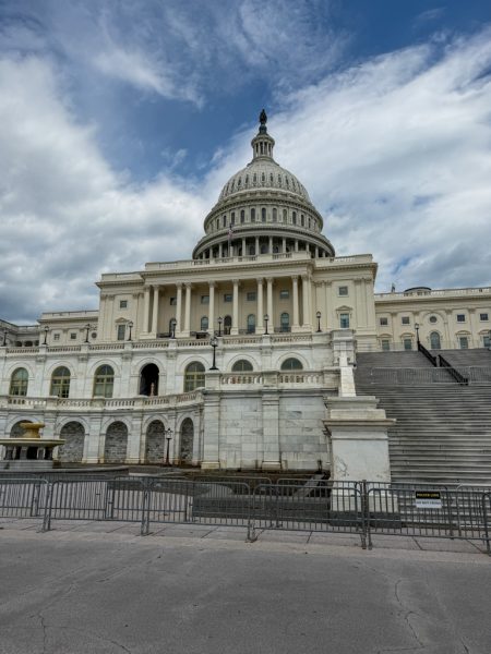 The U.S. Capitol under a partly cloudy sky